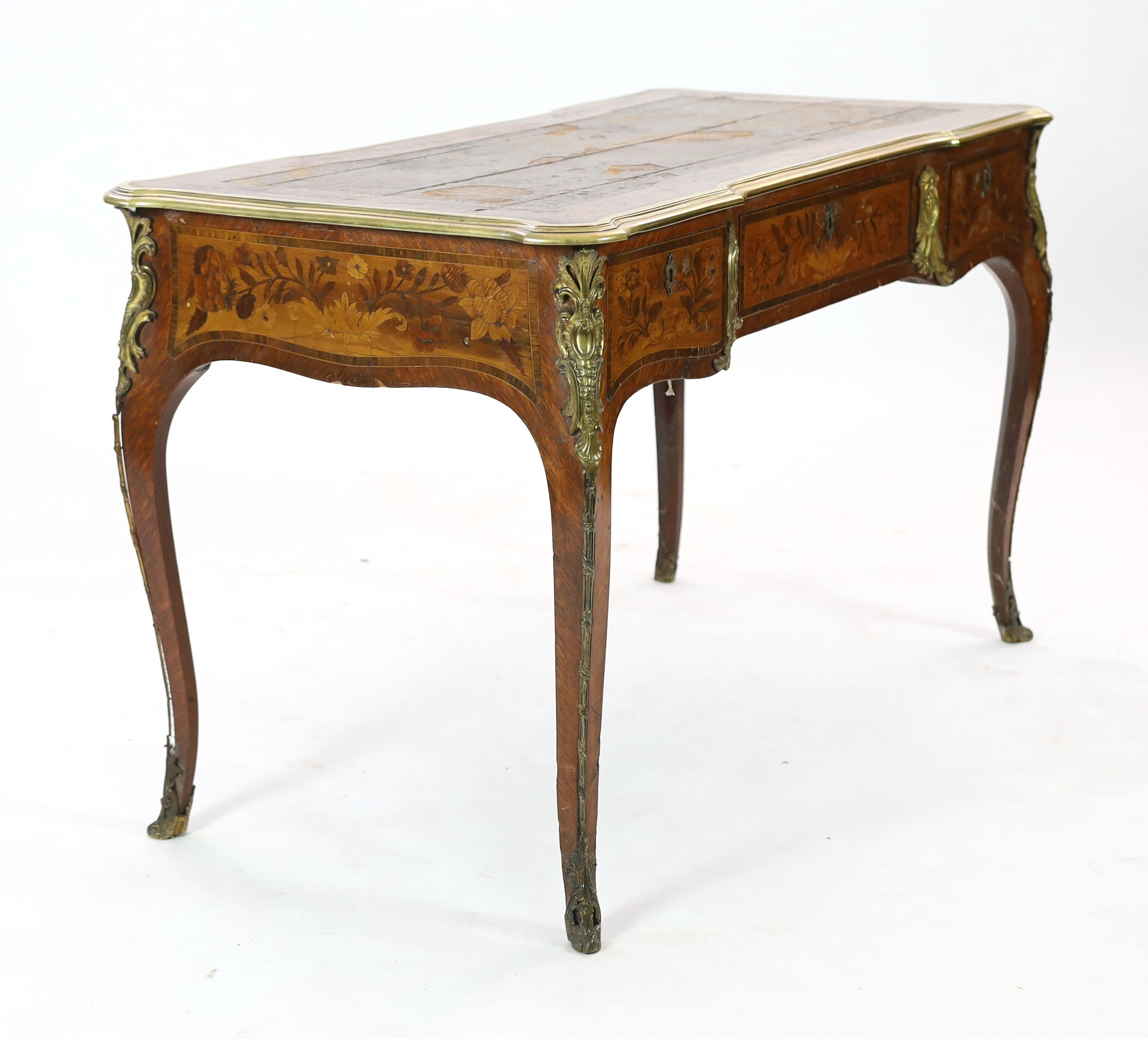 An early 20th century Louis XVI style ormolu mounted marquetry bureau plat, W.123cm D.64cm H.76cm